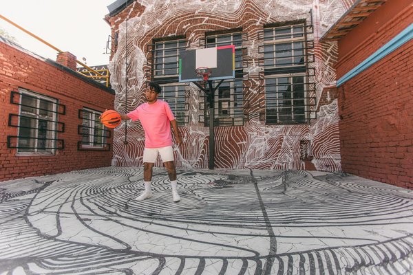 How can professional surfers protect their skin from sun damage during competitions?